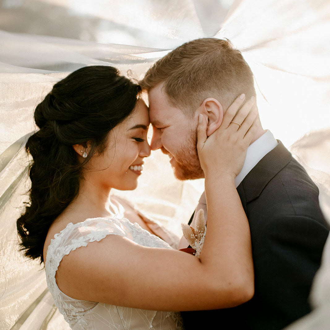 Newlyweds embracing for photo