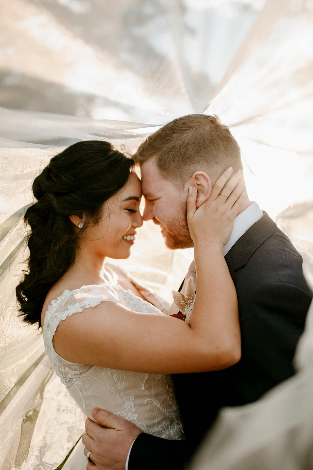 Newlyweds embracing for photo